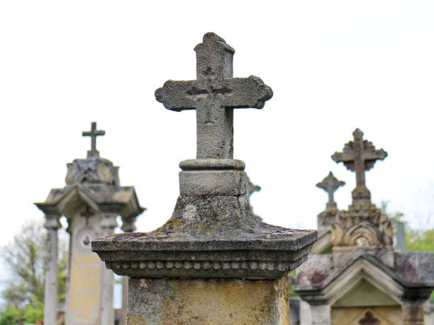 istock Four stone cross the cemetery 675220288