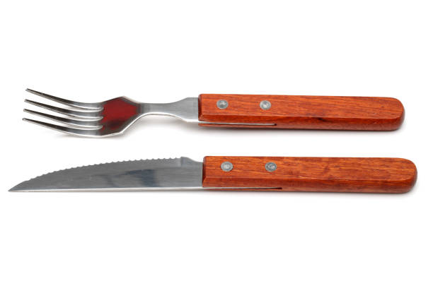 istock Isolated image of a set of fork and knife on white 675220656