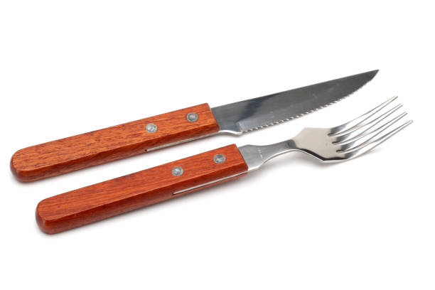 istock Isolated image of a set of fork and knife on white 675220658