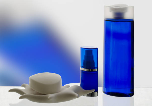 Cosmetic products in  blue tones with reflection