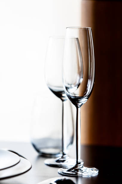 istock Empty glasses for champagne and wine are on the table in a row. 675223618