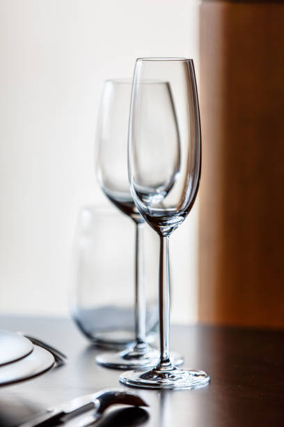 istock Empty glasses for champagne and wine are on the table in a row. 675223620