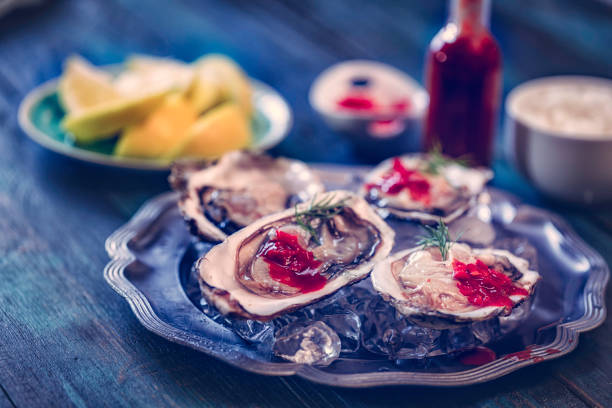 istock Fresh Oysters with Lemon and Hot Sauce 675230324