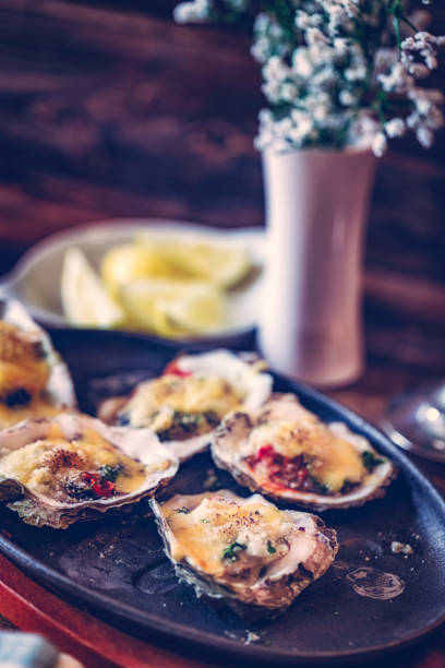 istock Eating Baked Oysters au Gratin 675230456