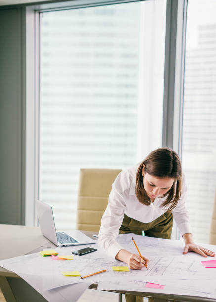istock Young woman working at the office 675233546