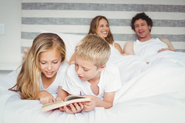 istock Family relaxing on bed 675237398