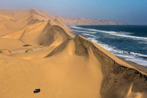 istock Magical jeep - safari through sand dunes 675243168
