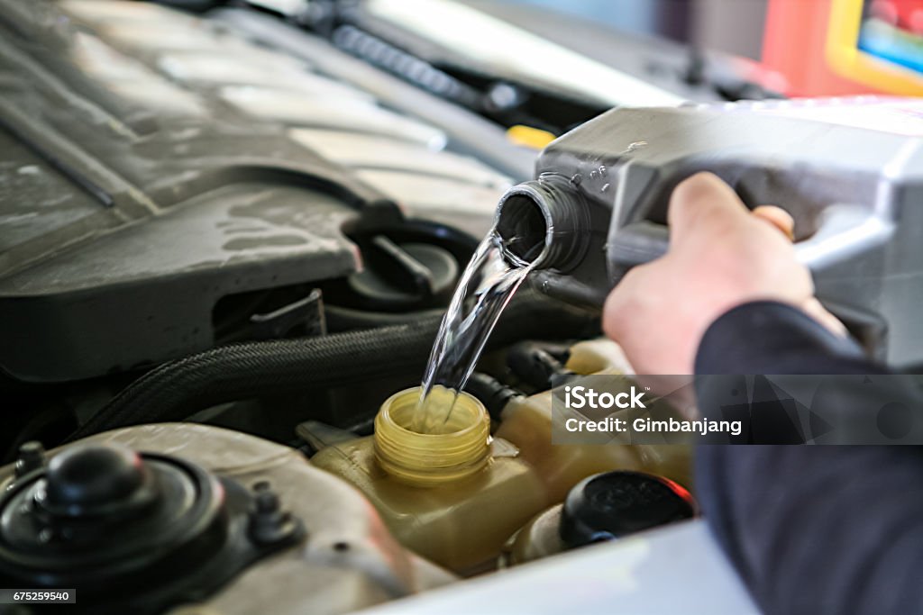 Check and fill car coolant Car Stock Photo