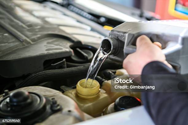 Check And Fill Car Coolant Stock Photo - Download Image Now - Car, Water, Coolant