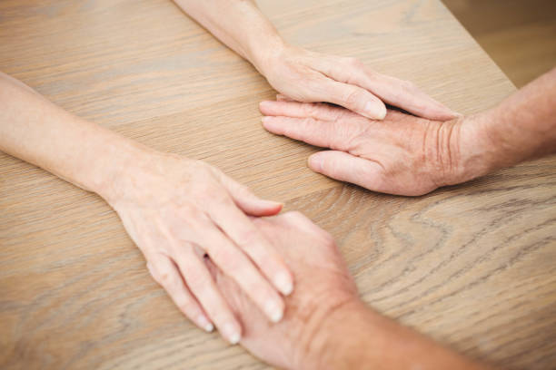 istock Senior couple holding hands 675262116