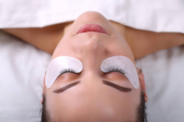 istock Eyelash Extension Procedure. Woman Eye with Long Eyelashes. Lashes, close up, macro, selective focus 675268008