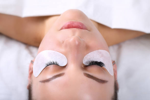 istock Eyelash Extension Procedure. Woman Eye with Long Eyelashes. Lashes, close up, macro, selective focus 675268042