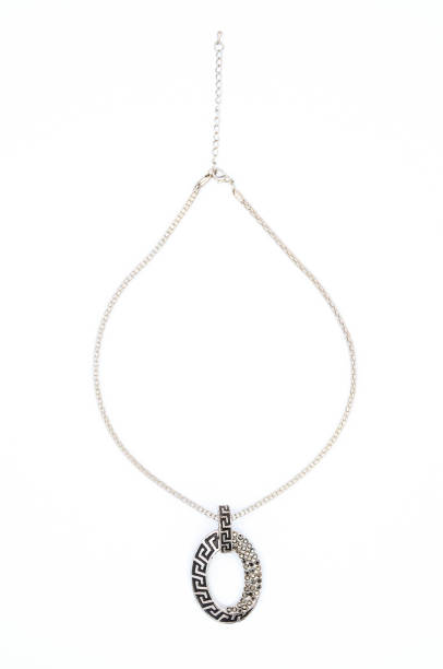 istock oval silver pendant with gems isolated on white 675268108