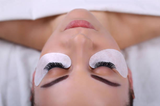 istock Eyelash Extension Procedure. Woman Eye with Long Eyelashes. Lashes, close up, macro, selective focus 675268174