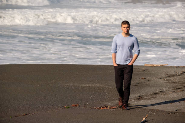 istock Lone man at USA Pacific coast beach 675272082