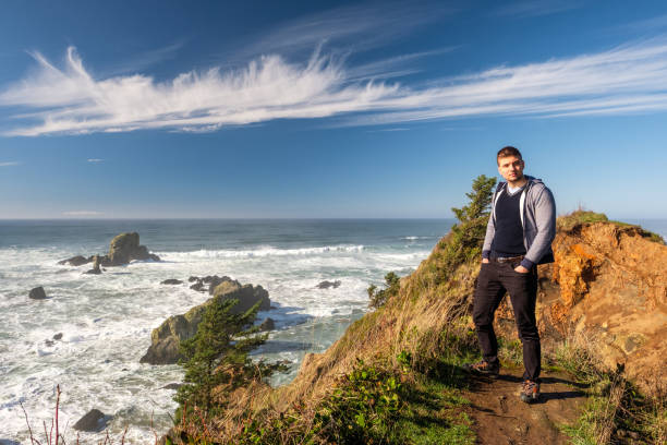 istock Lone man at USA Pacific coast landscape 675272202