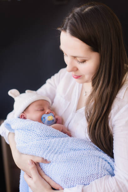 istock Young mother holding her newborn child. 675285348