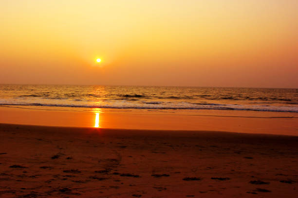 Golden colored sunset over Arabian sea in Goa India
