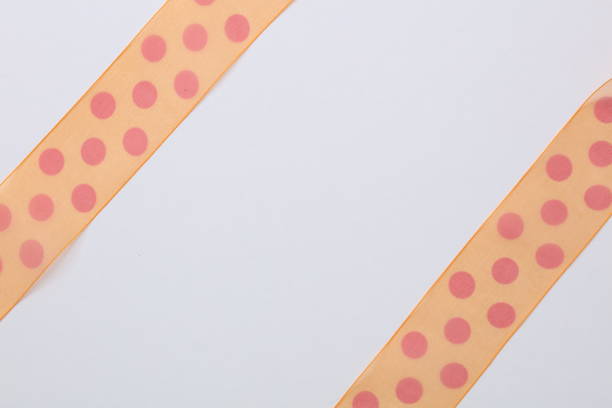 istock Orange ribbon isolated on white 675289678