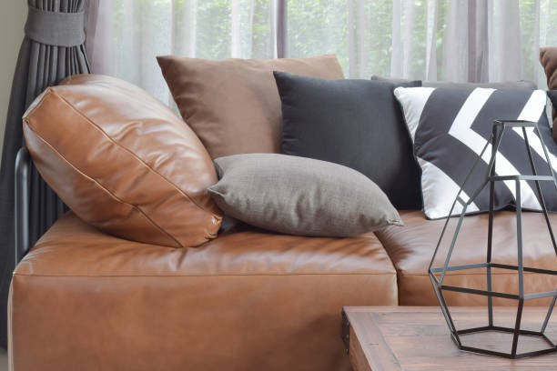 istock Light brown leather sefa bed with varier color and size pillows 675295000