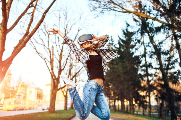 istock Pretty girl enjoy virtual reality glasses 675295246