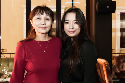 The photo shows two female Kazakhs. To the left is mother, on the right is her daughter.