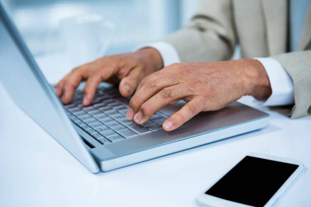 istock close up view of a businessman using his laptop 675301042