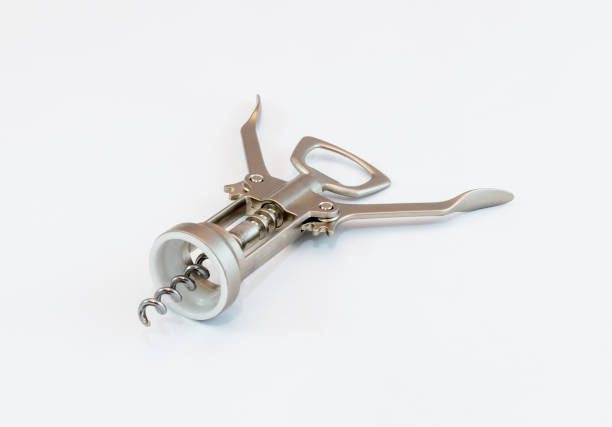 istock Mechanical corkscrew made of light brushed metal on white background 675303682