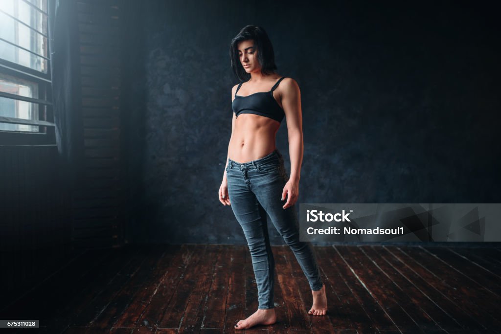 Contemp style dancer poses in dance class Contemp style dancer poses in dance class. Grace young woman in studio Active Lifestyle Stock Photo