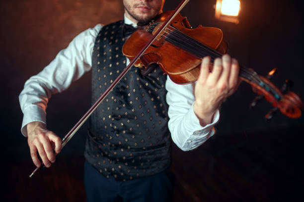 istock Male fiddler playing classical music on violin 675315314