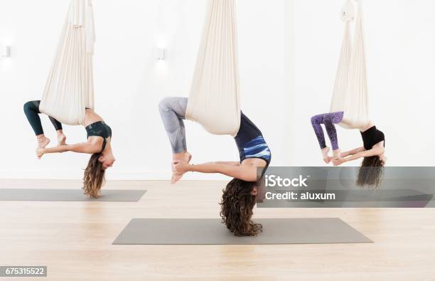 Aerial Yoga Class Stock Photo - Download Image Now - Yoga, Aerial Yoga, Hammock
