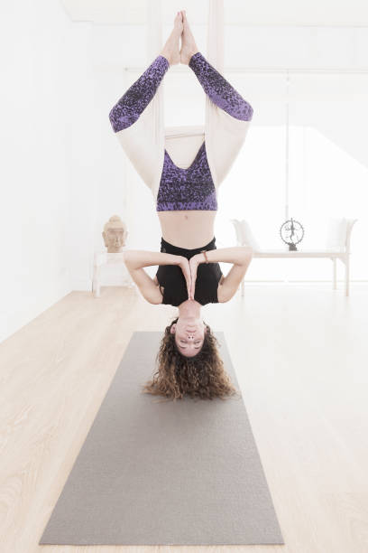 istock Woman practicing aerial yoga 675315528