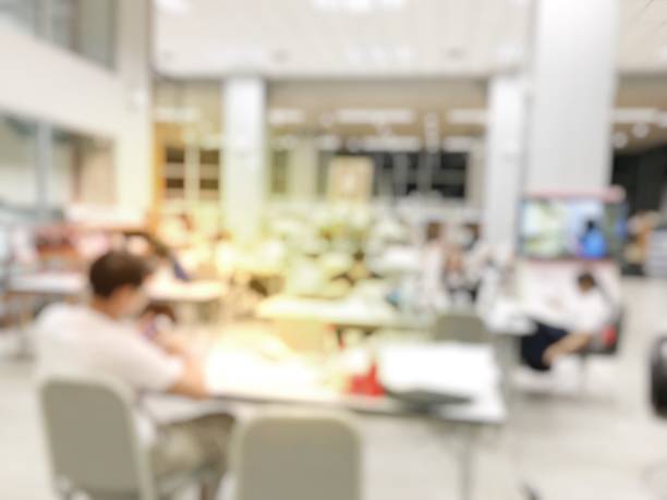 istock blurred tudents preparing for the final examination in library 675323442