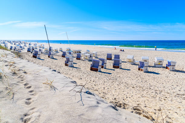 istock Chairs on white sand Kampen beach on Sylt island, Germany 675331434