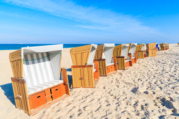 istock Beach chairs in morning light on sand, Sylt island, Germany 675331654
