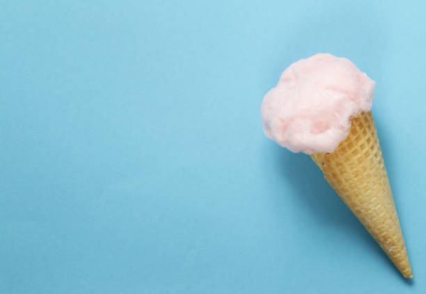 istock Sweet pink cotton candy in a waffle cone 675338346