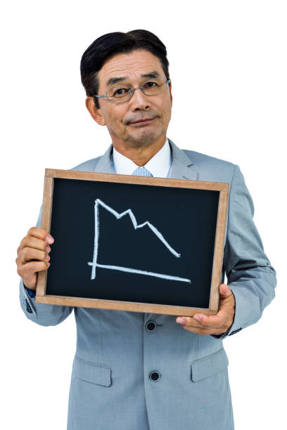 Asian businessman showing black board on white background