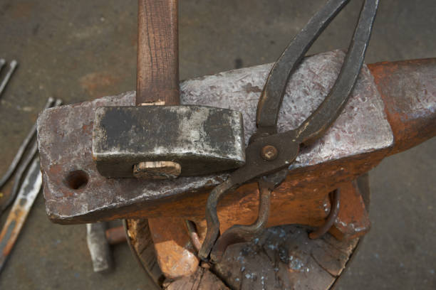 istock The blacksmith's tools are an anvil, a hammer and pincers 675340836