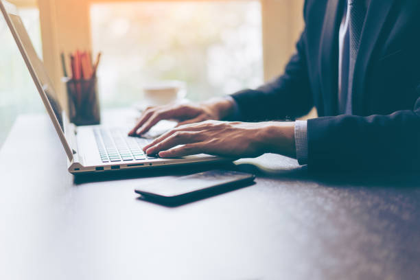 istock Hand of businessman using his laptop 675344904