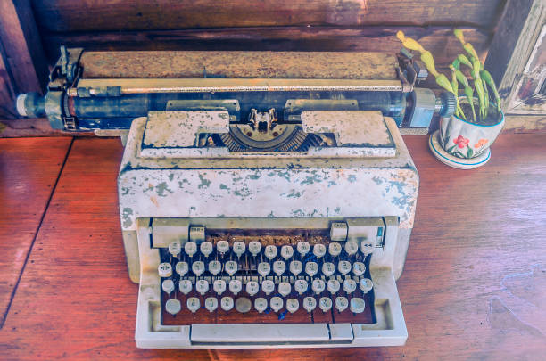 istock the old typing machine on wooden table with effect filter 675348226