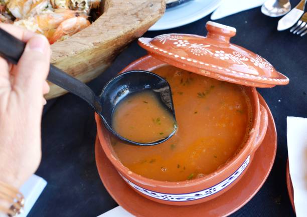 istock Seafood soup on a traditional casserole. 675352548