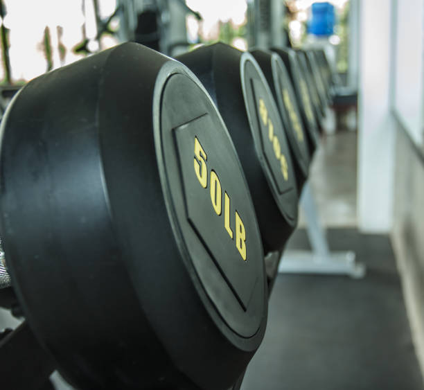 istock Dumbbells in the gym weight Training Equipment 675362198