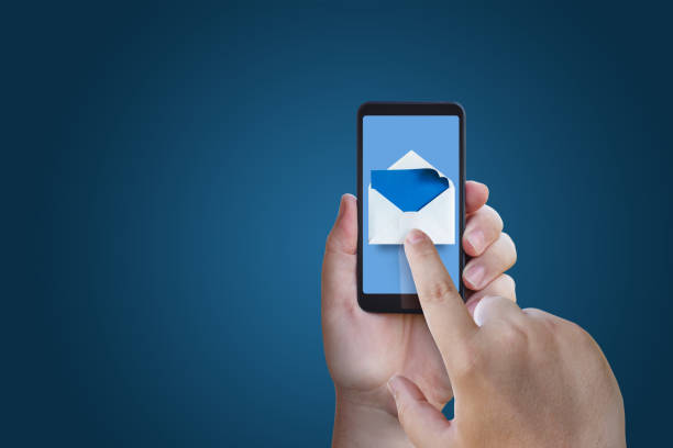 istock Businessman running with email in phone. 675368322