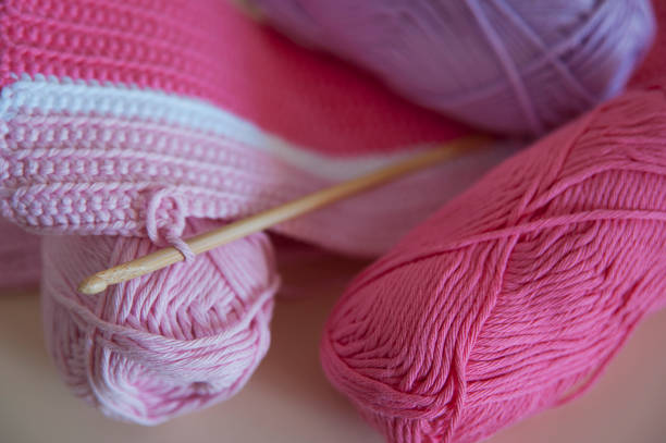 istock Soft, baby pink yarn for crocheting or knitting 675368816