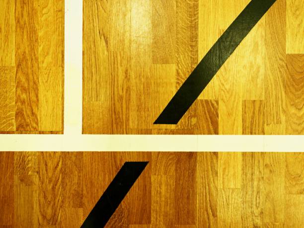Black lines in hall playground. Worn out wooden floor of sports hall with marking lines stock photo