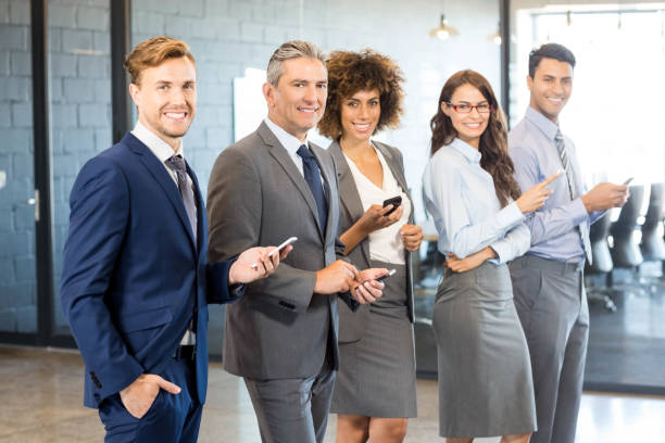 istock Business team using their mobile phone 675371570
