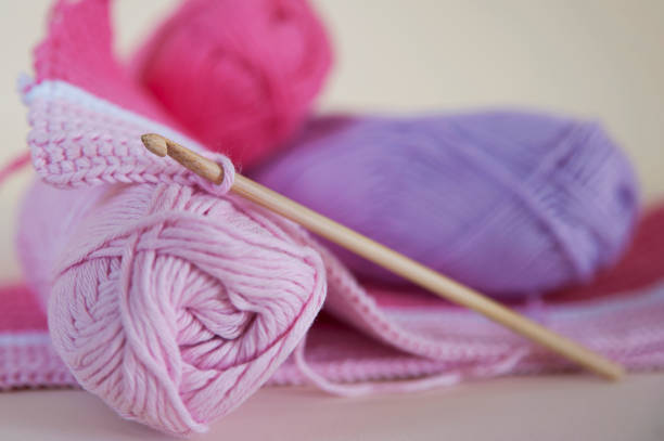 istock Soft, baby pink yarn for crocheting or knitting 675375538