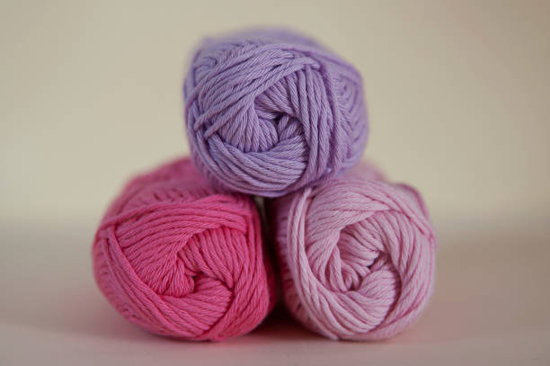 istock Lilac, rose and pink cotton yarn for knitting, needlework, or crochet projects 675375982