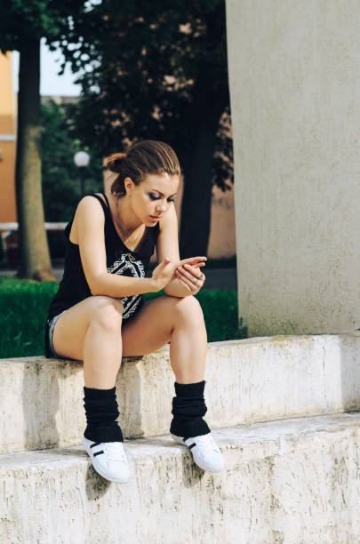 istock Woman relaxing and sitting on bench 675376062