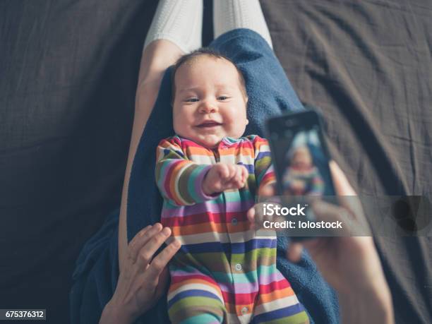 Mother Taking Photo Of Her Baby Stock Photo - Download Image Now - Photographing, Baby - Human Age, Mother